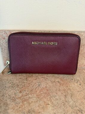 Michael Kors Zip-Around Wallet in Deep Burgundy with Gold Tone Logo